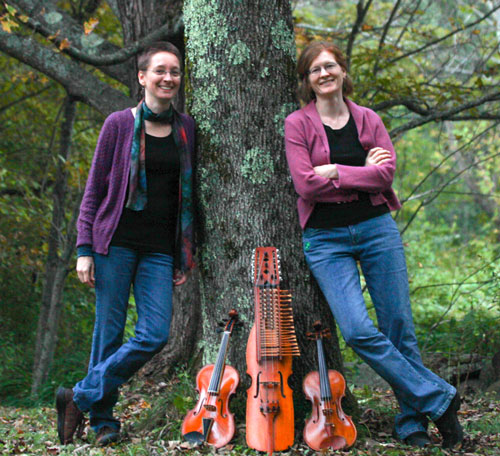 lydia and Andrea with instruments and tree